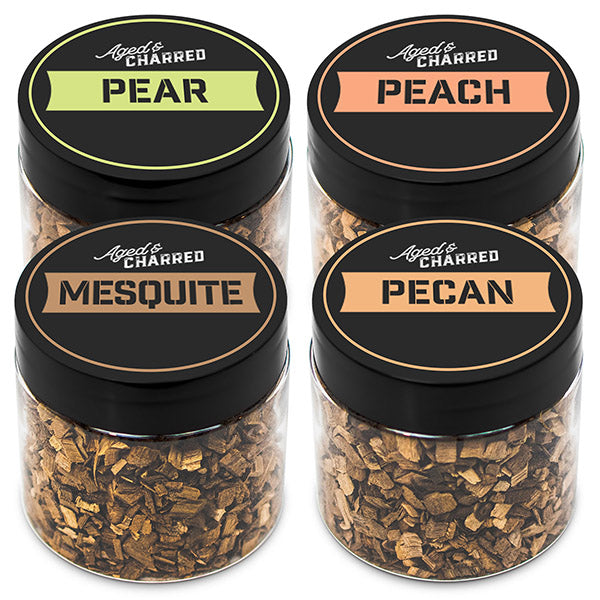 Four containers labeled peach, pear, mesquite, and pecan, containing wood chips for cocktail smoking.