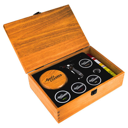Premium Smoke Lid Kit includes a beautiful wooden box, Smoke Lid, four wood chip flavors, culinary torch and butane.