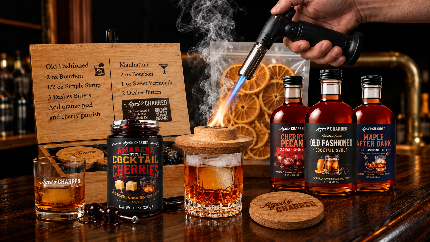 Whiskey lover’s gift basket with a cocktail smoker, torch, syrups, cherries, and Old Fashioned cocktails